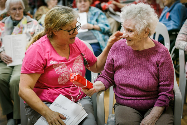 donor Elderly Woman with a Present
