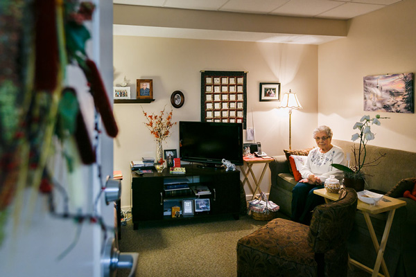 suites Elderly Woman Sitting on a Couch